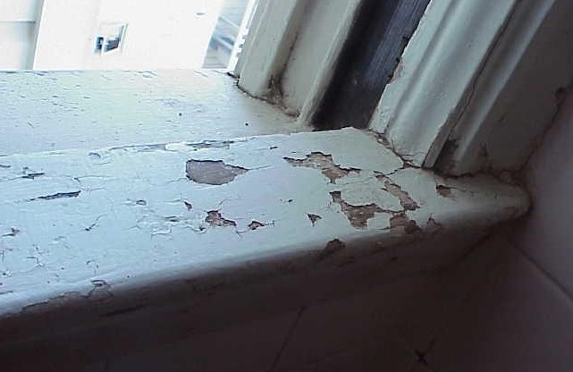 Damaged paint on interior window sill