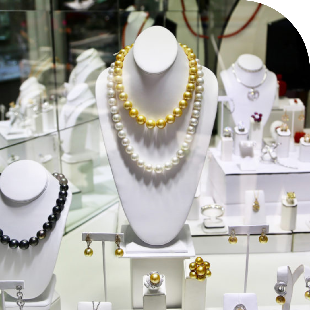 Photo of display case with pearl necklaces