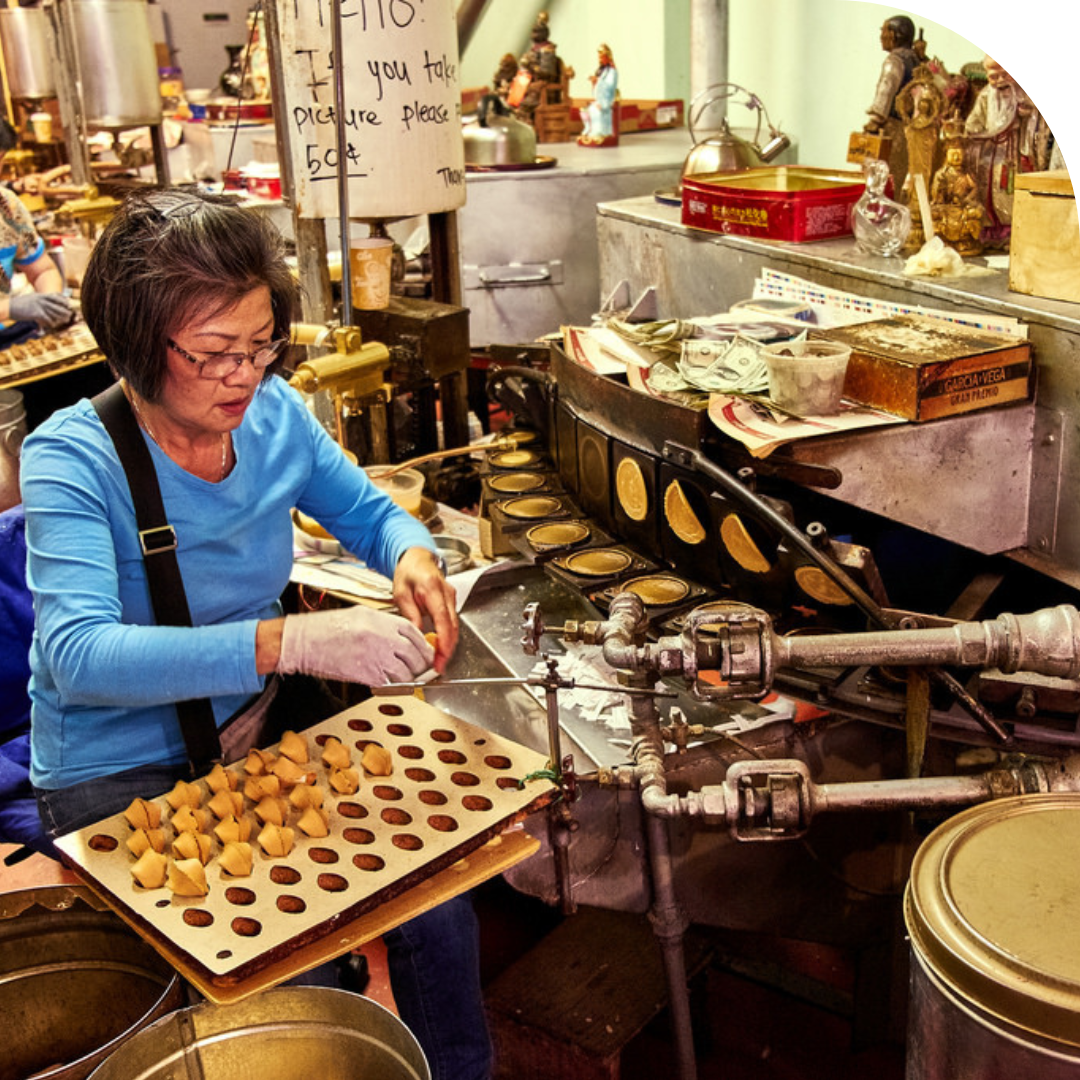Photo of a woman making fortune cookies