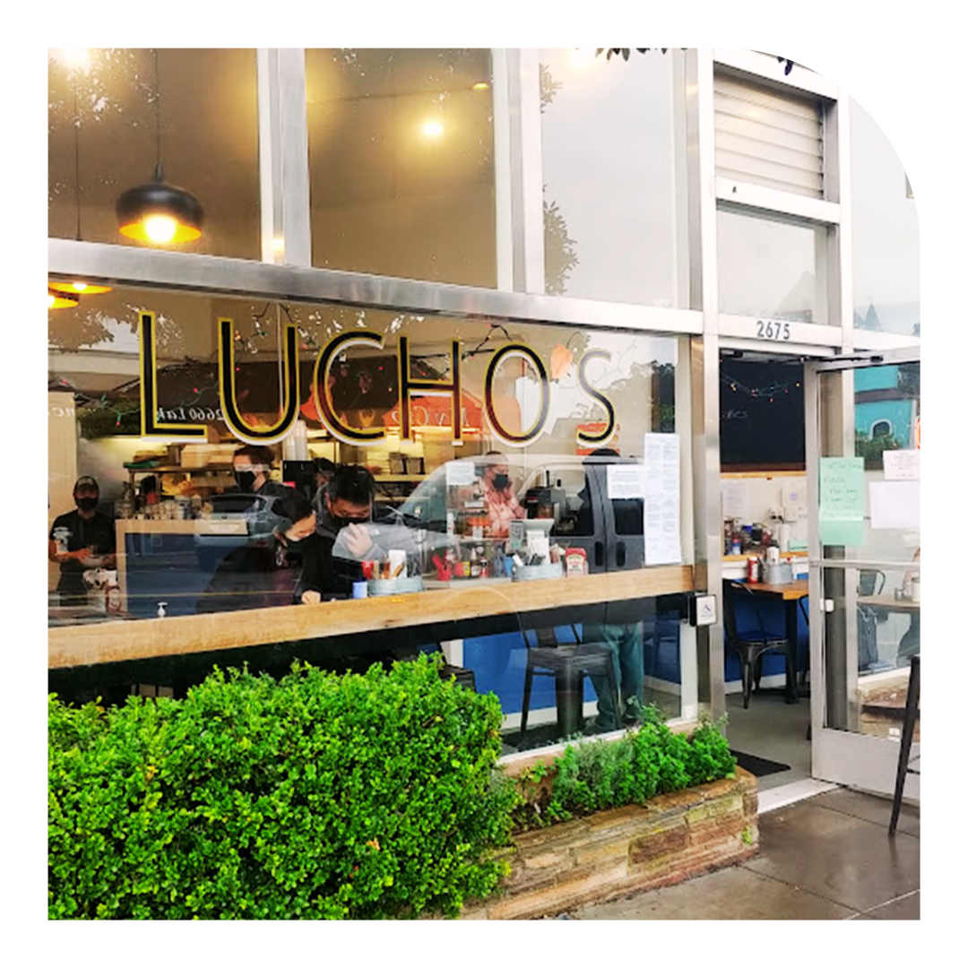 Photo of the front window of Lucho's Restaurant