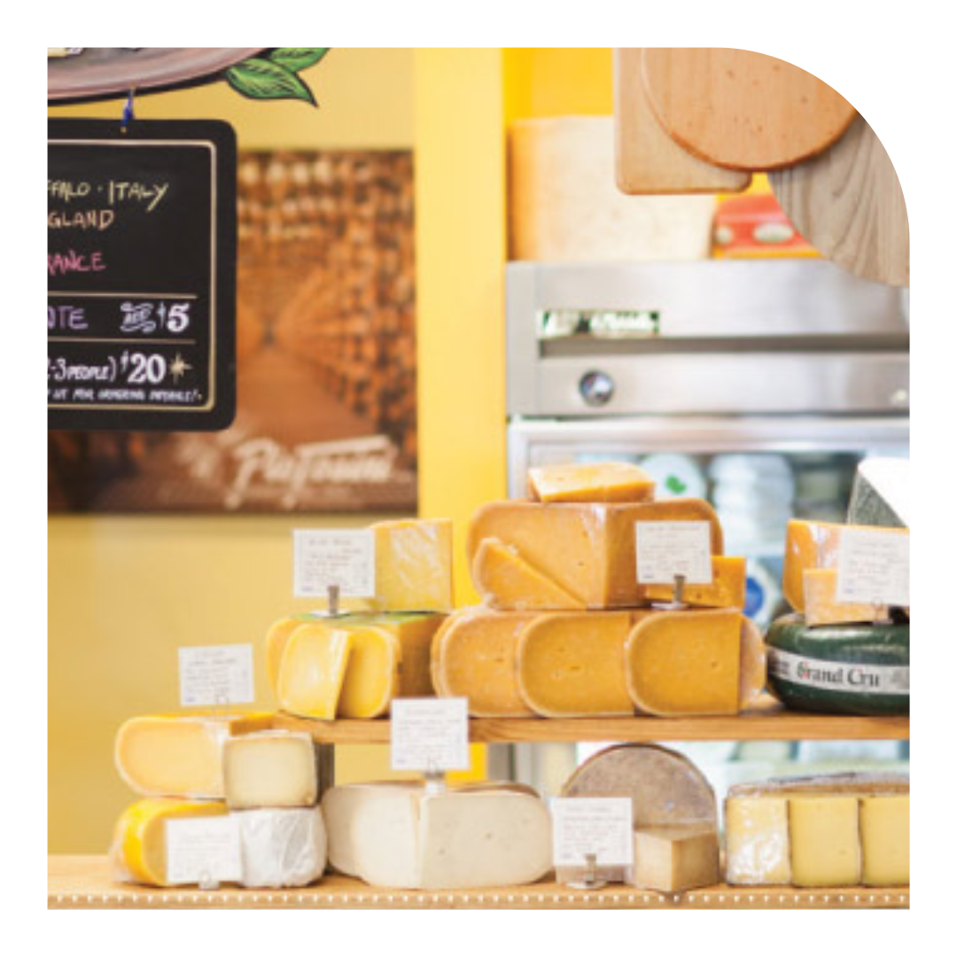 Photo of a shop display of cheese