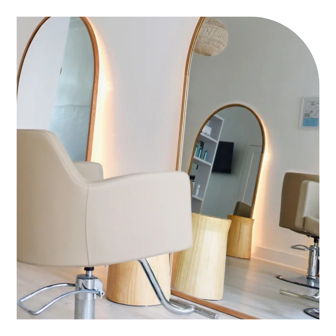 photo of white salon chair with gold hardware
