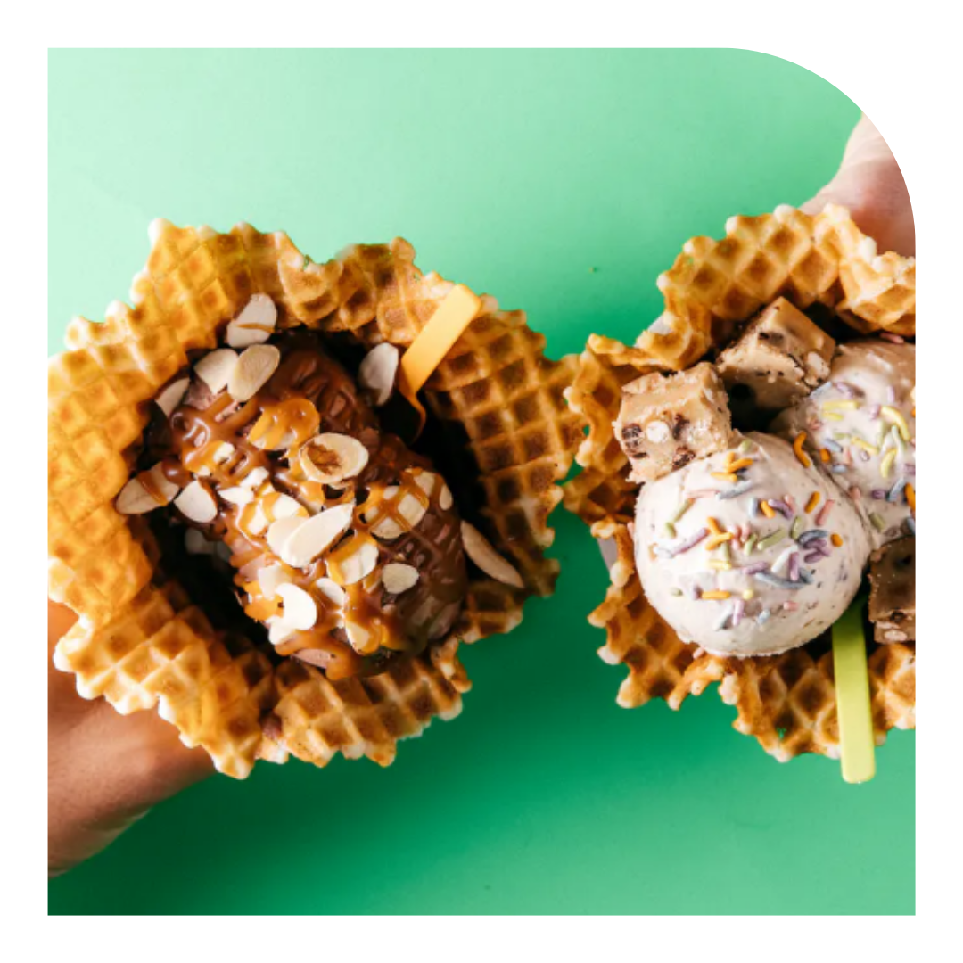 overhead photo of two ice cream cones in waffles cones