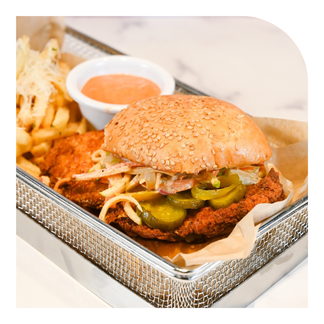 photo of a crispy chicken sandwich on a silver tray