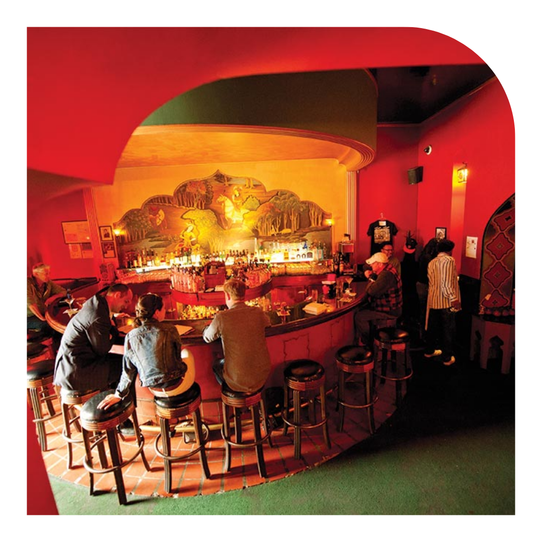 photo of the inside of a bar, with red walls