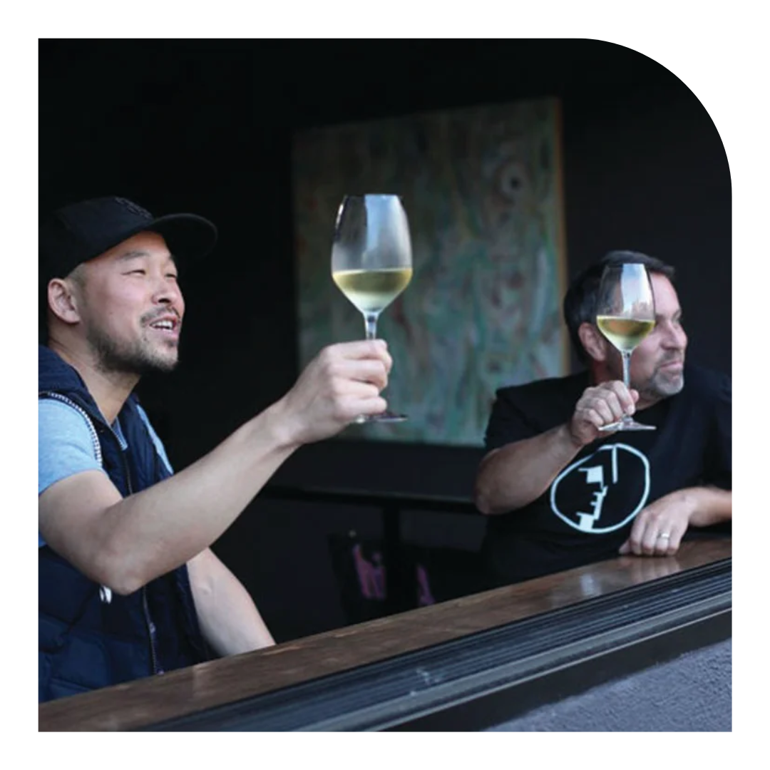 photo of two people drinking wine