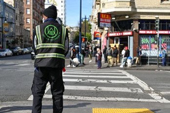 A man stands in a crosswalk
