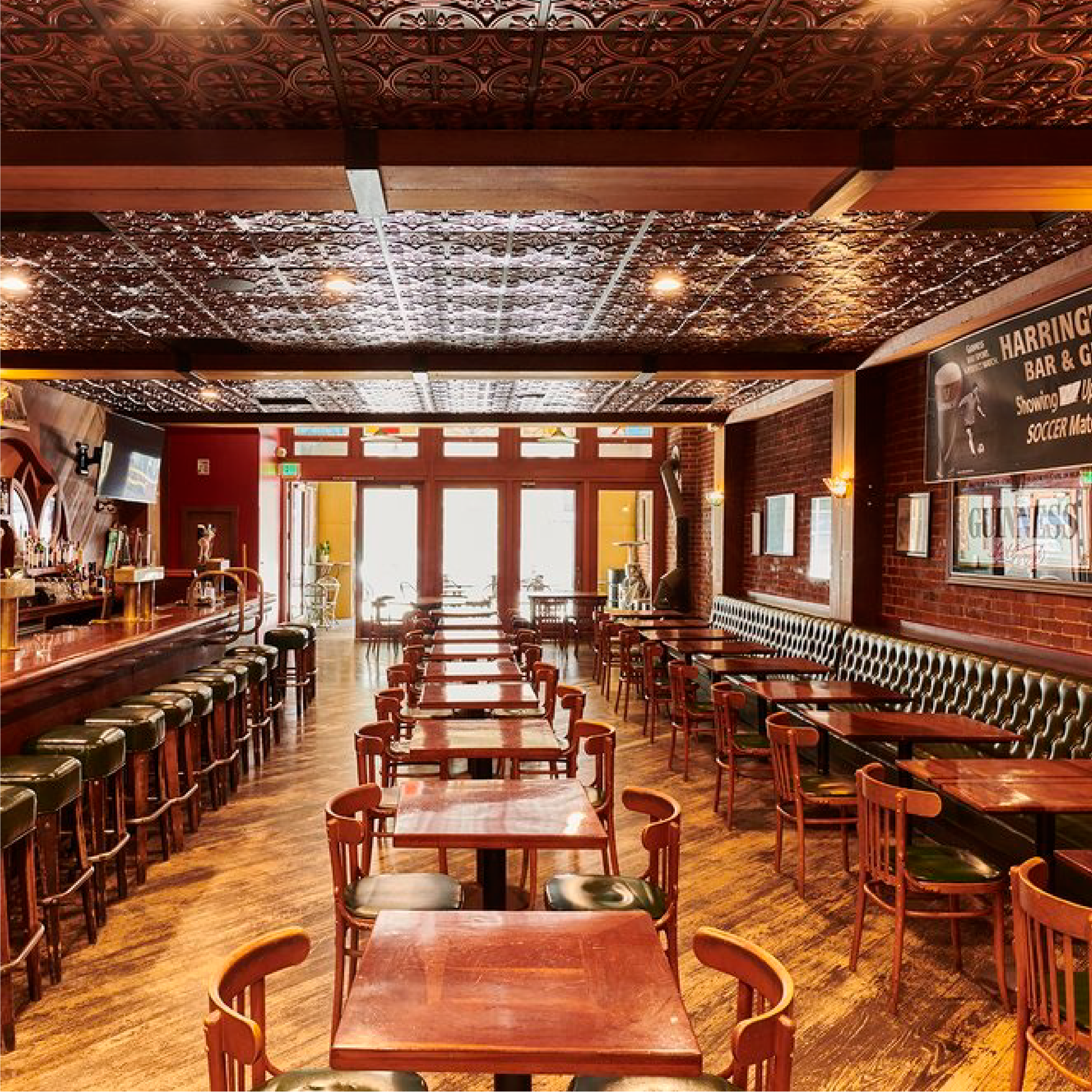 A image of tables and chairs in wood bar setting