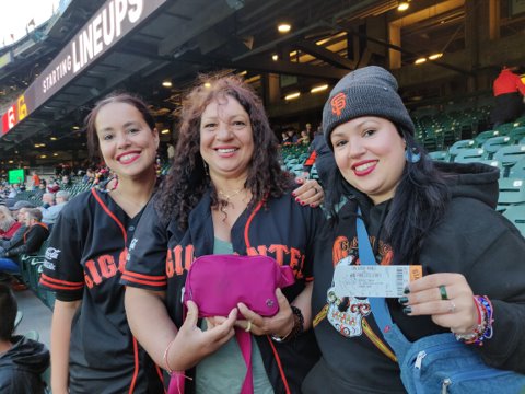 winners of the intentional walk program  pictured enjoying their prize tickets to the Giants  baseball game 