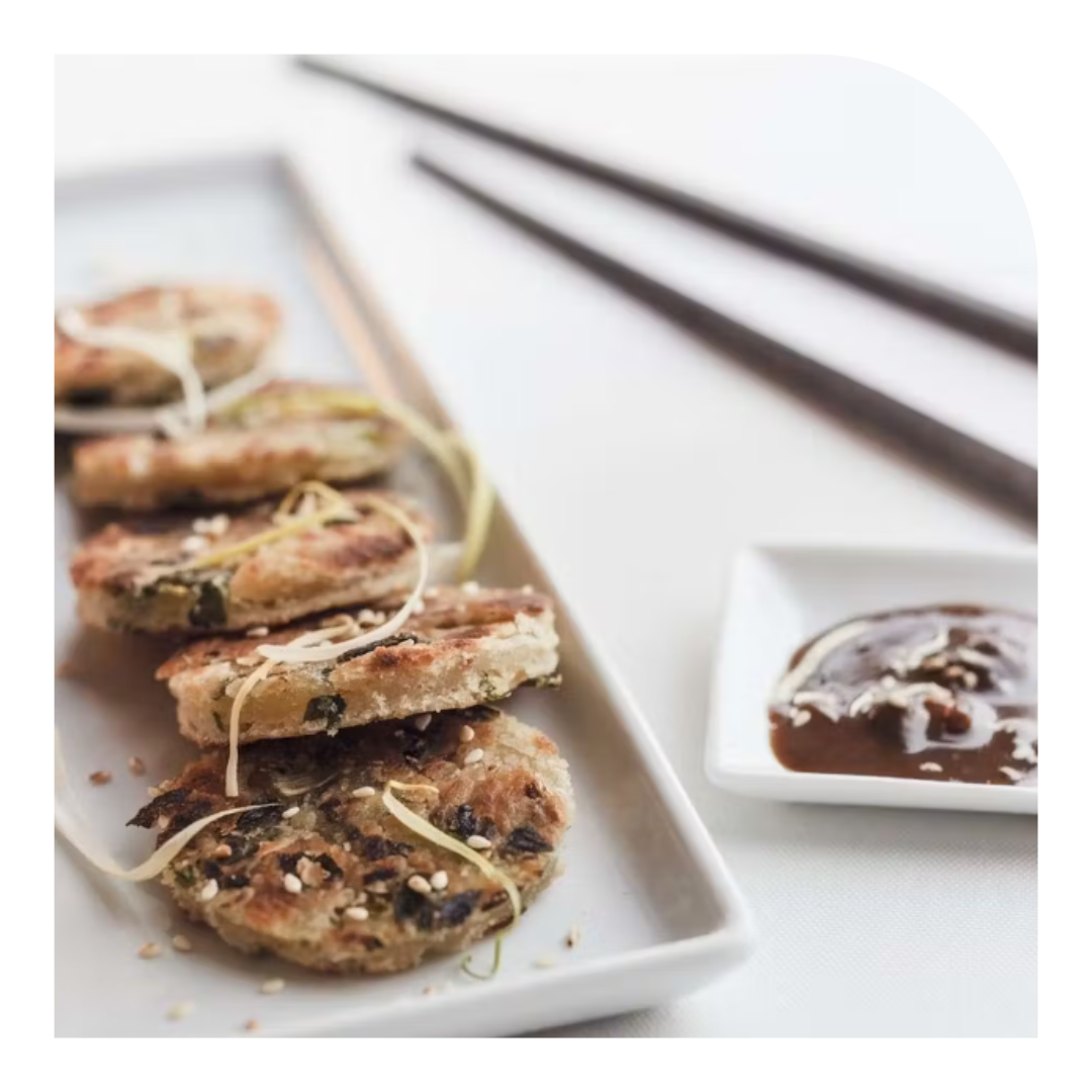 photo of a plate of food with chopsticks