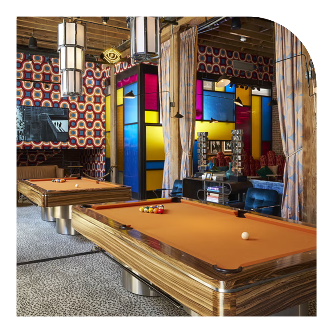 photo of a large room with two pool tables