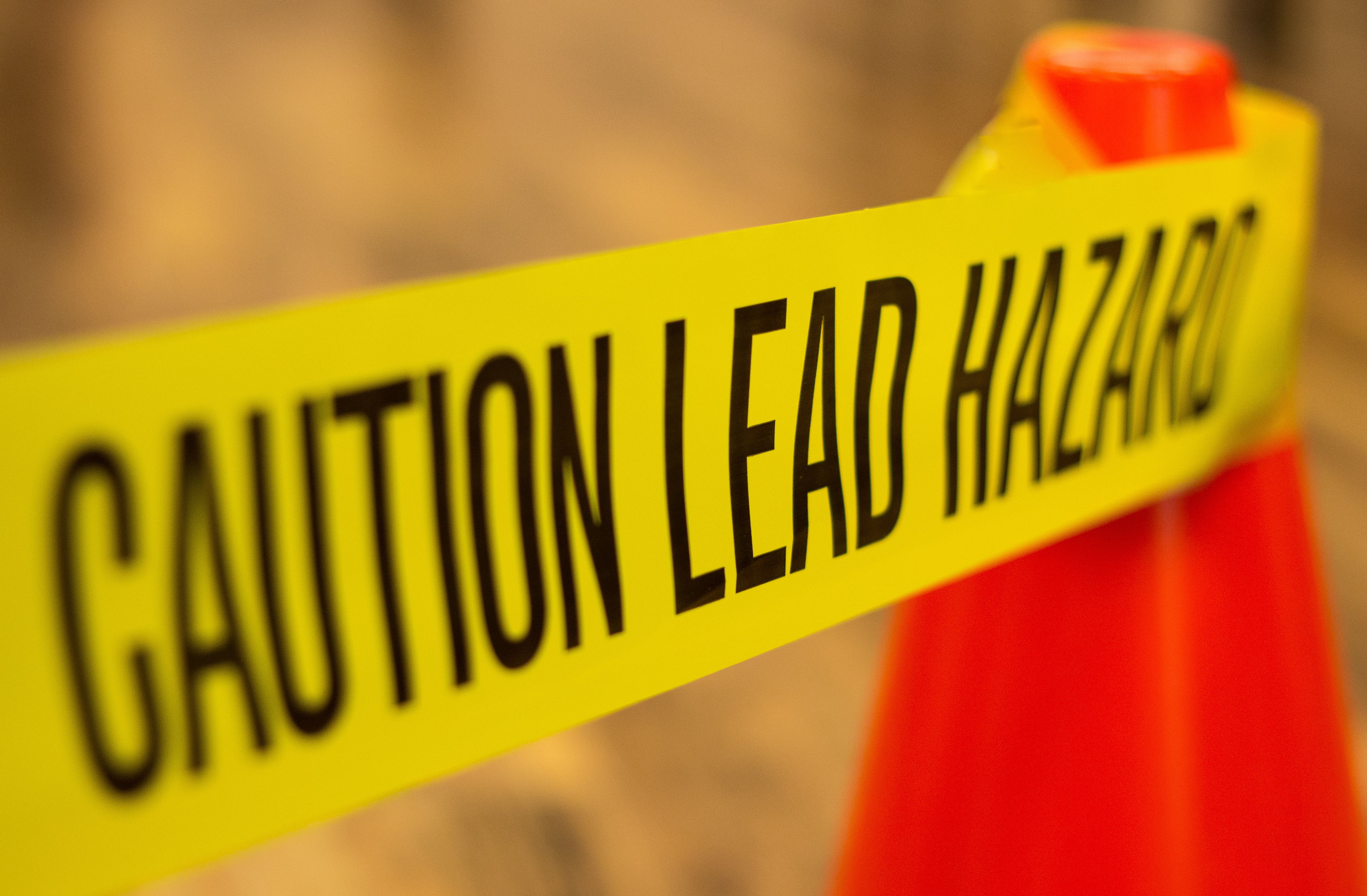 Caution Lead Hazard with construction safety cones