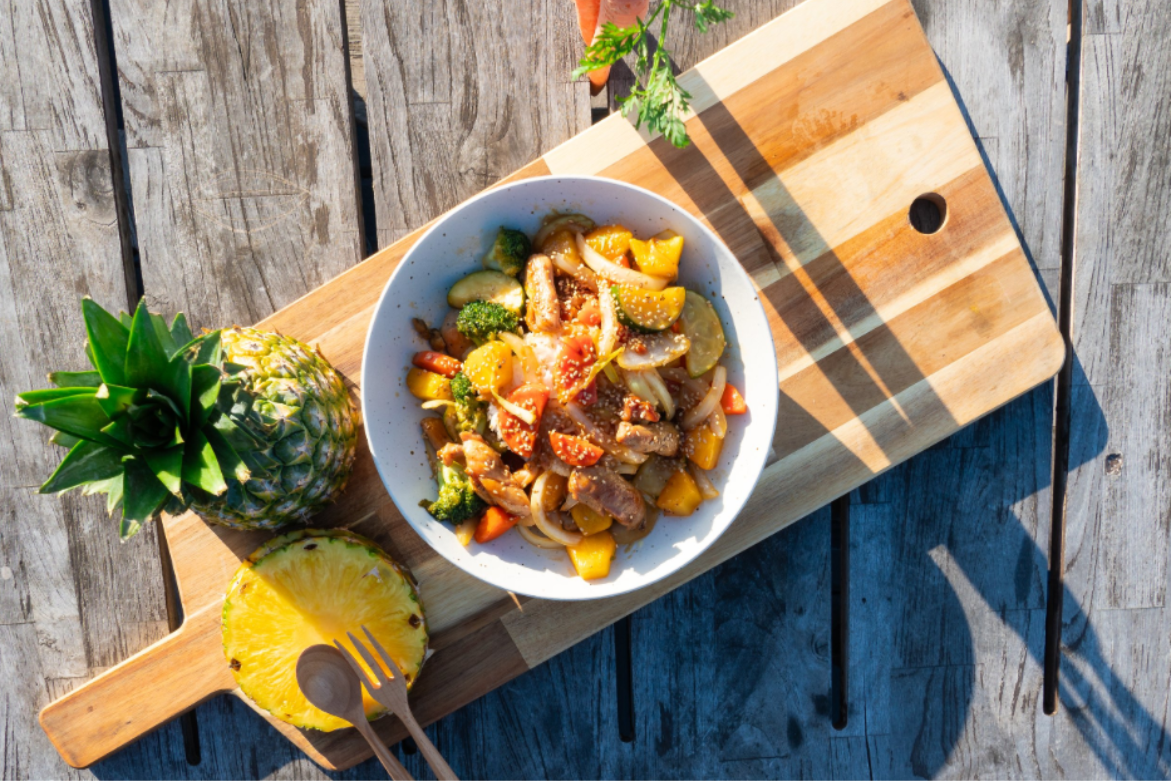 overhead photo of a plate of food with a pineapple on the side