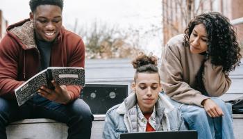 People using a laptop