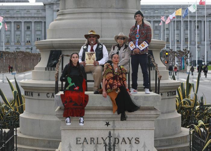 Image of five Native Americans situated on top of the Early Days plinth