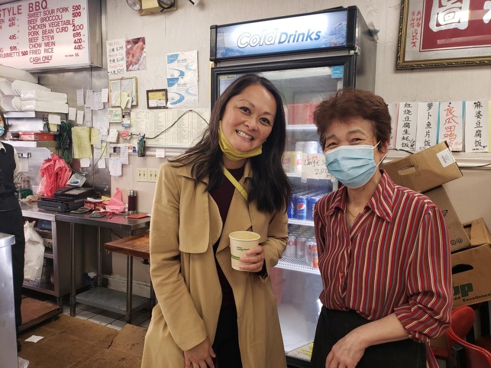 City Administrator Carmen Chu poses with a small business owner of a Chinese restaurant.