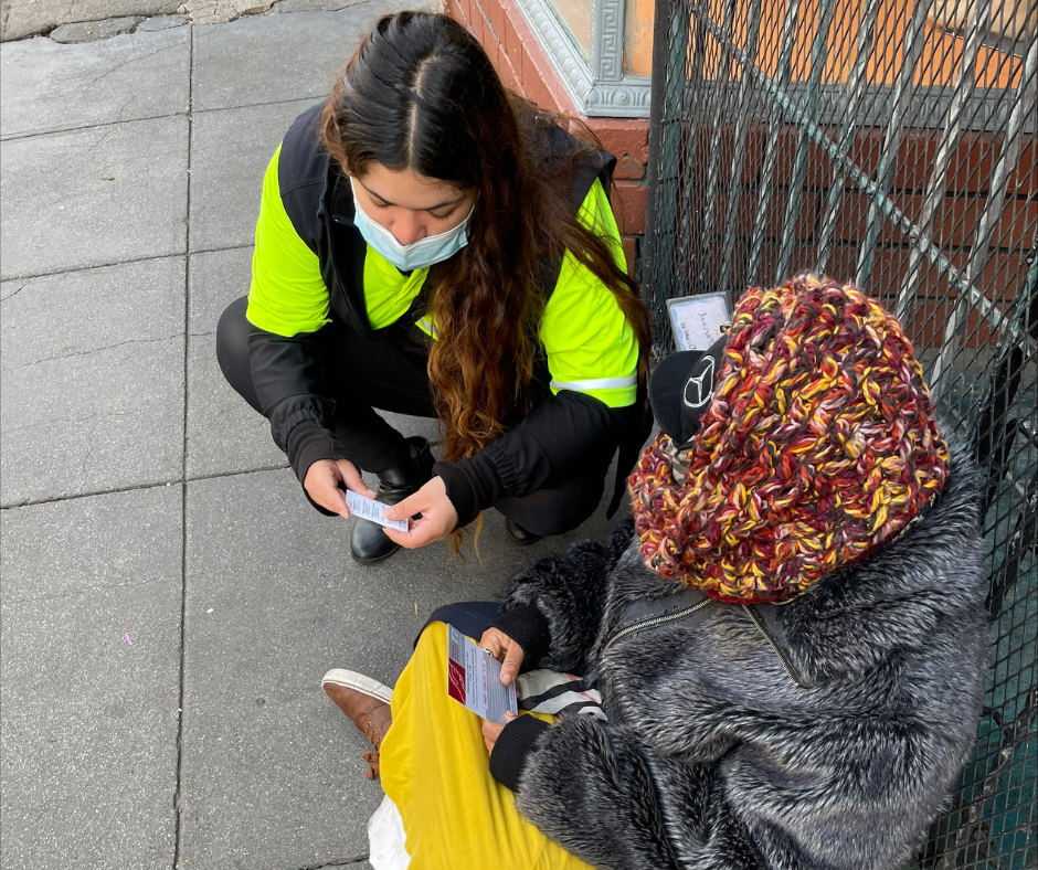 A Community Ambassador helps someone connect to shelter resources