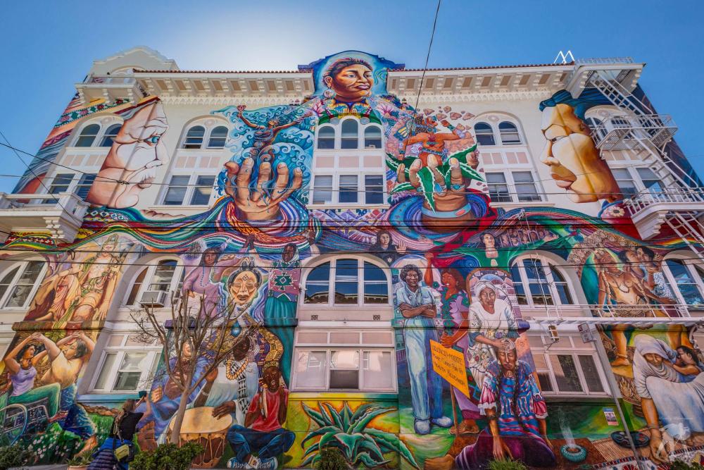 The Women's Building mural with colorful figurative art on facade.