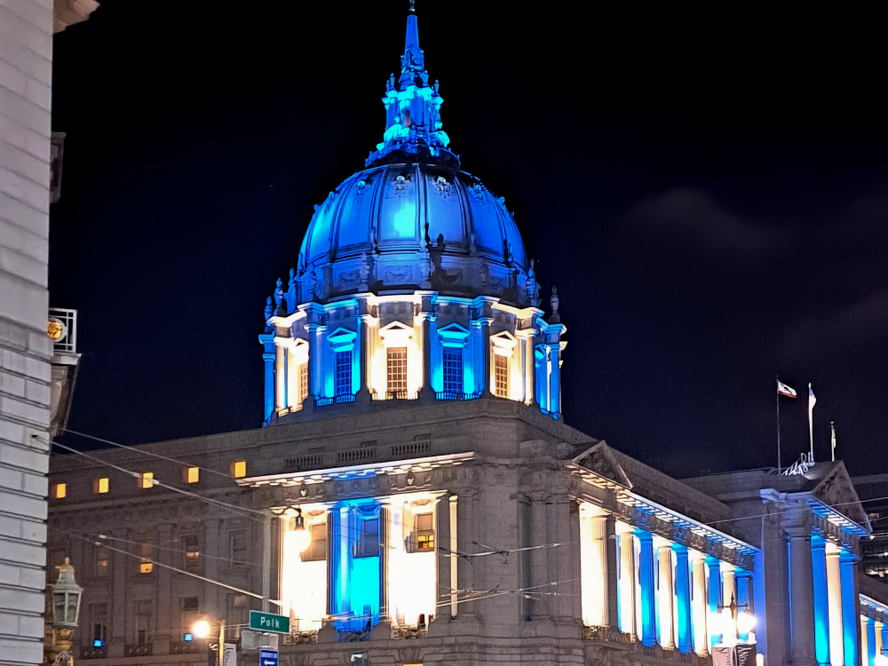 City hall in teal lights for Digital Inclusion Week