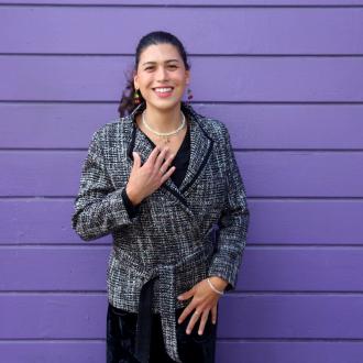 headshot of Cherry Javier from Office of Transgender Initiatives in black blazer in front of purple background