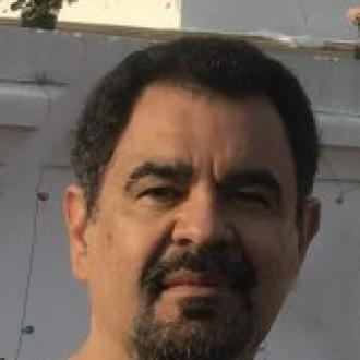 A picture of Director Salvador Menjivar