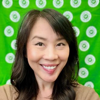 photo of woman in front of a green background